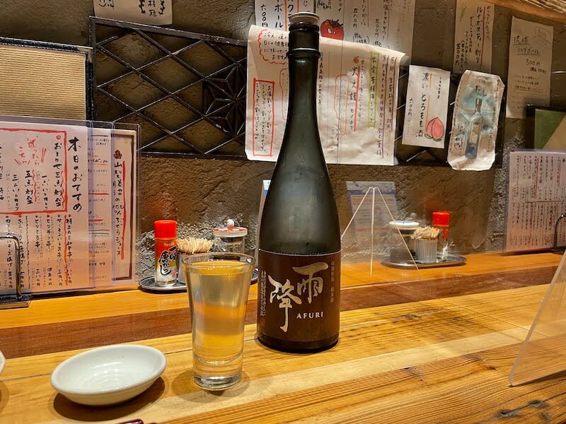 小田急相模原にある居酒屋「旬鮮酒場NOBU」に置いてある「雨降（あふり） 山廃仕込 純米酒」の写真